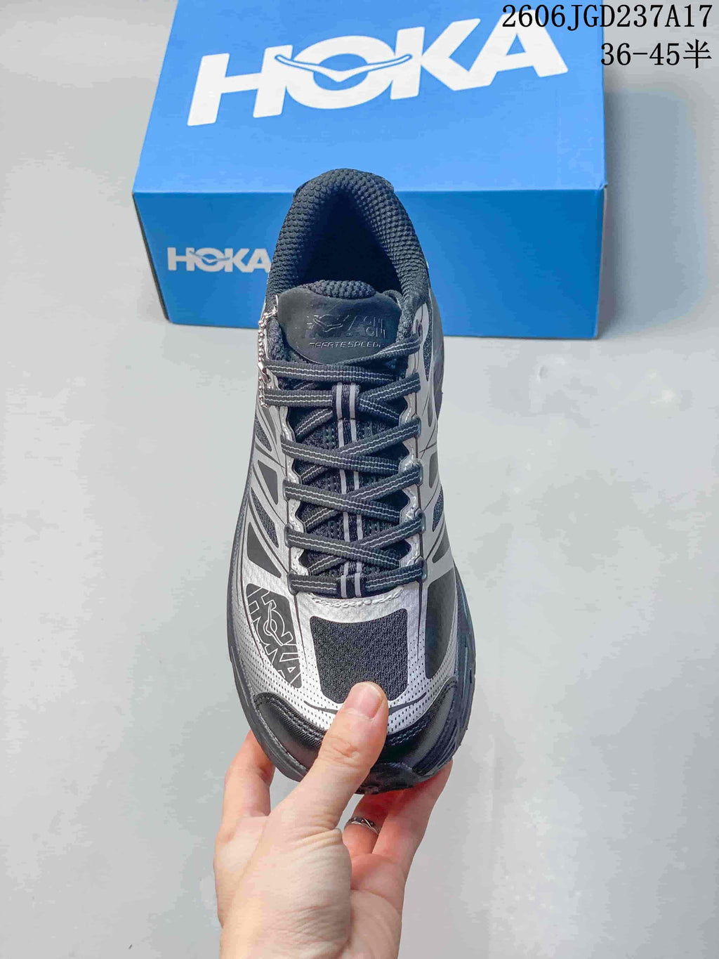 Top view of the laces and patterned upper on a HOKA trail shoe