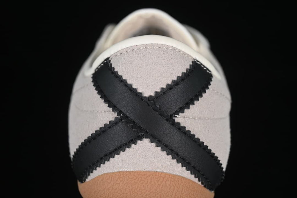 Close-up of the heel with crossed black panels and gum-colored outsole