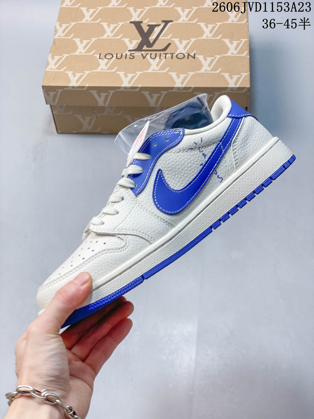 Side view of the off-white and blue sneaker with a contrasting Swoosh