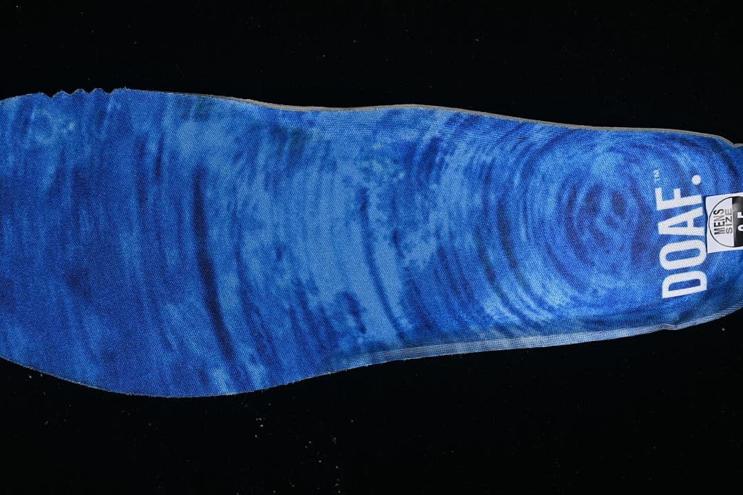 Blue printed insole detail with a partially visible men's-size marking