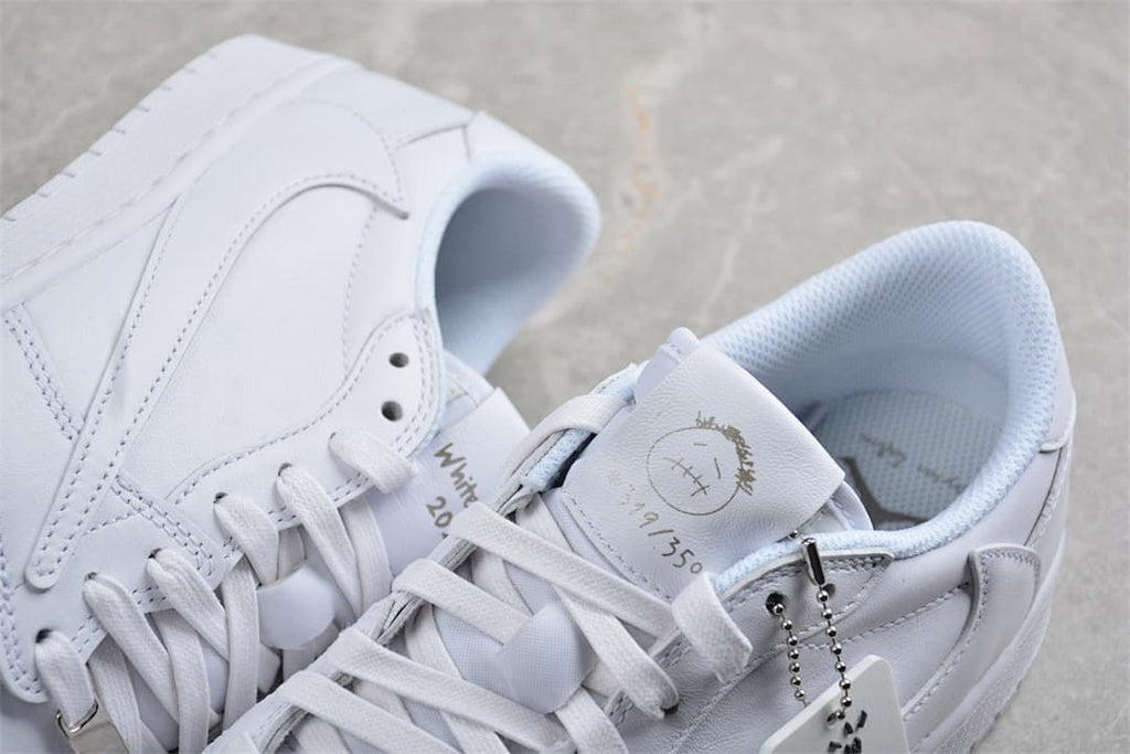 Close-up of the white sneaker tongue, laces, and decorative details