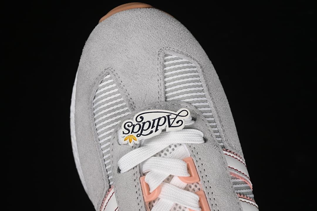 Top view of the gray toe and lace area with a decorative lace tag
