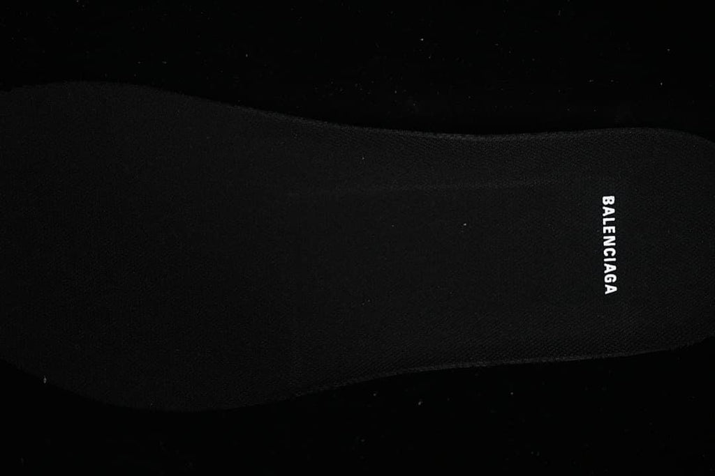 Black insole with white Balenciaga lettering.