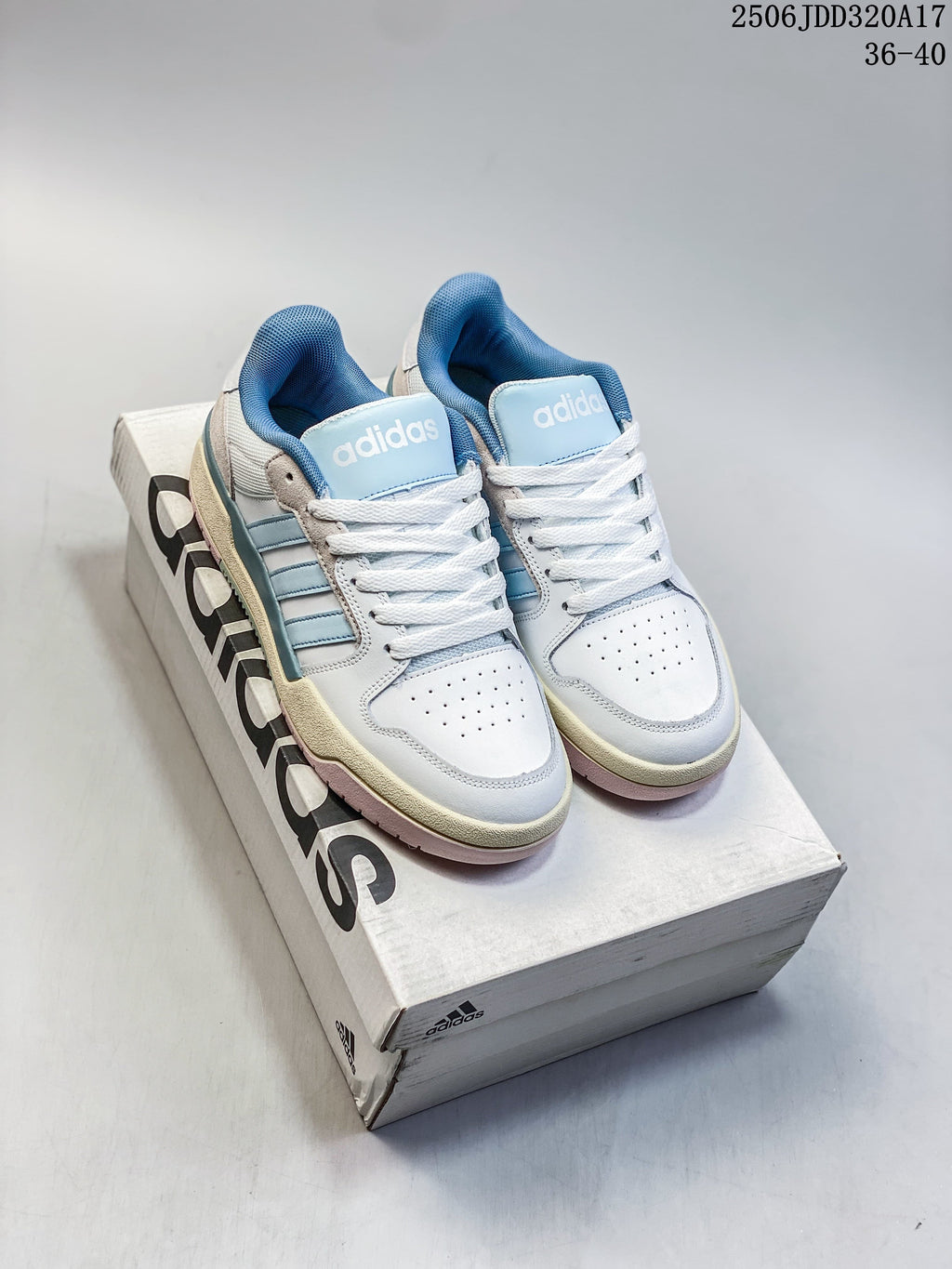 Pair of white and light blue adidas Entrap sneakers on a shoe box