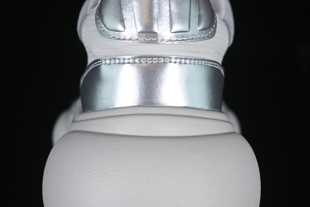 Rear view showing silver-tone heel accents and the sculpted sole