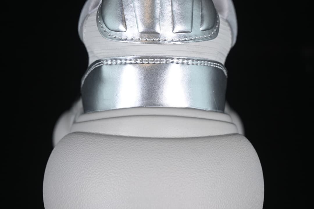 Rear view showing silver-tone heel accents and the sculpted sole