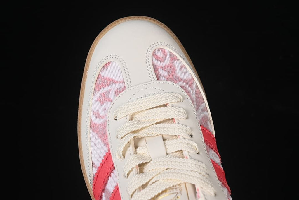 Top-down view of the toe, laces, and pink patterned panels