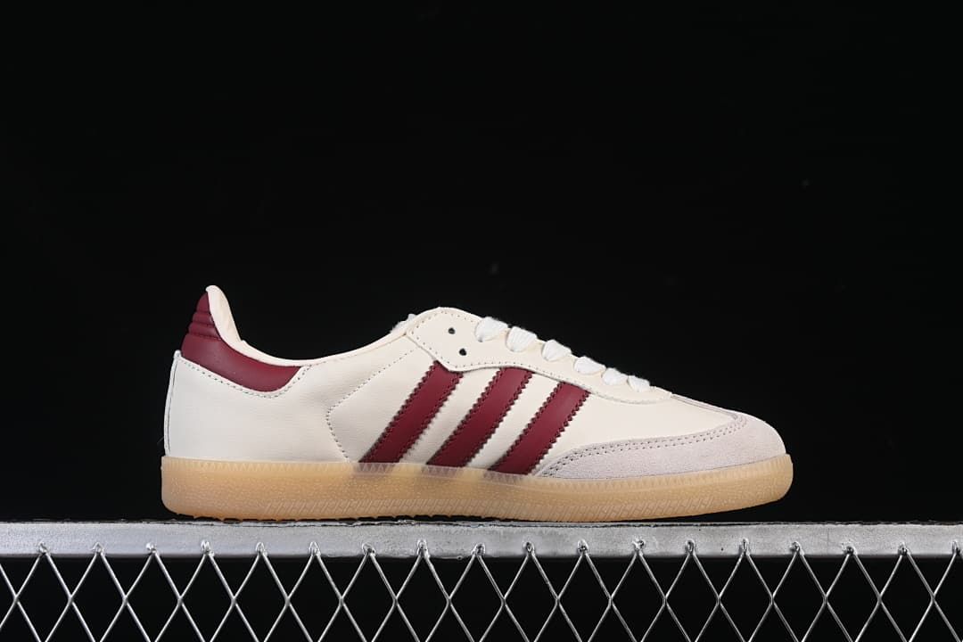Side profile of a cream Samba sneaker with burgundy stripes and gum-colored sole.
