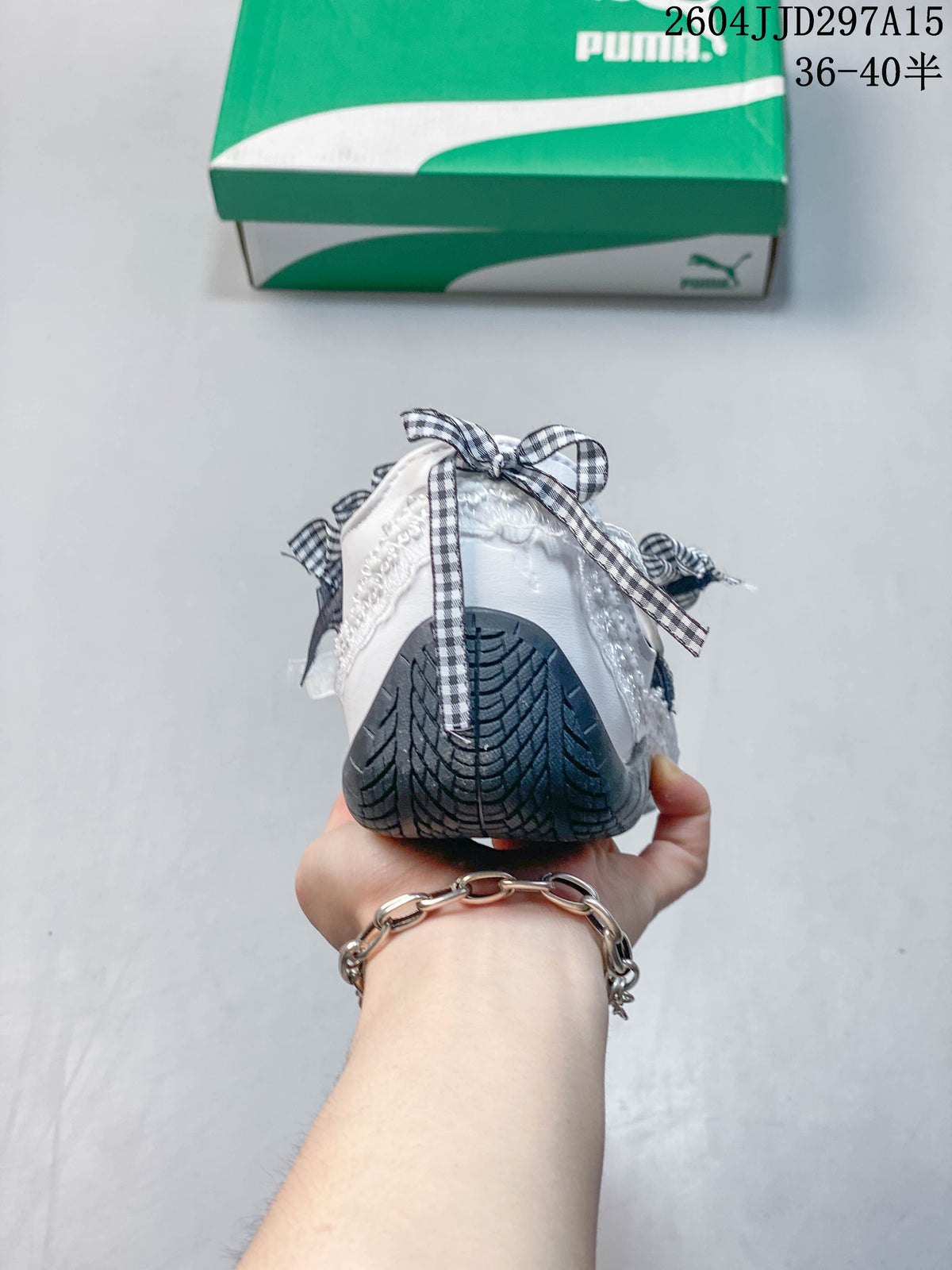 Rear view showing the dark patterned outsole and gingham bow detail.