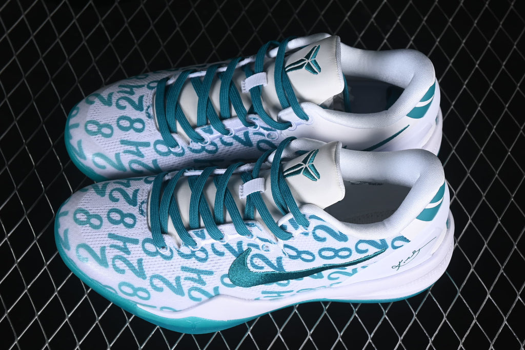 Angled view of the pair showing the patterned uppers and teal accents