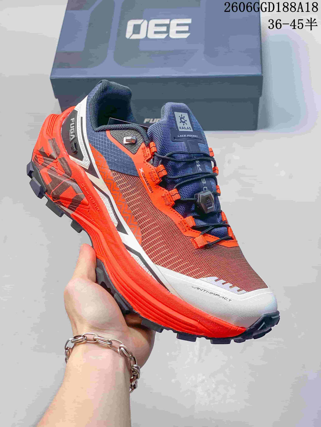 Kailas FUGA EX330 trail shoe in orange, brown, navy, and white with quick lacing