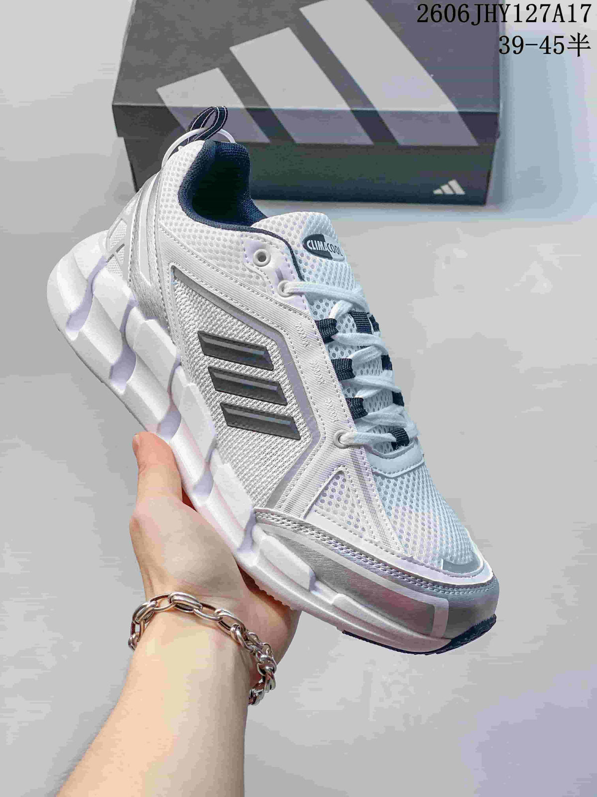 Side view of a white Adidas Climacool Ventage shoe showing its mesh-look panels, dark stripes and thick segmented sole.