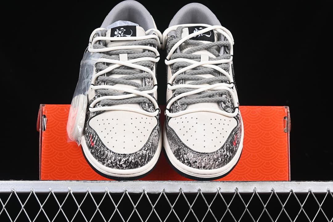 Front view of the pair showing perforated toe boxes and layered laces