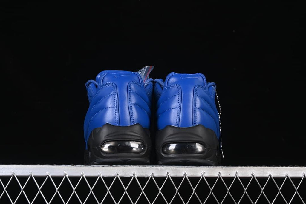 Rear view of the pair showing blue heels and visible Air units.