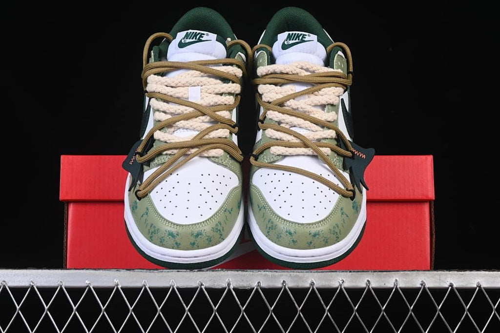 Front view of the pair showing perforated toes and layered laces