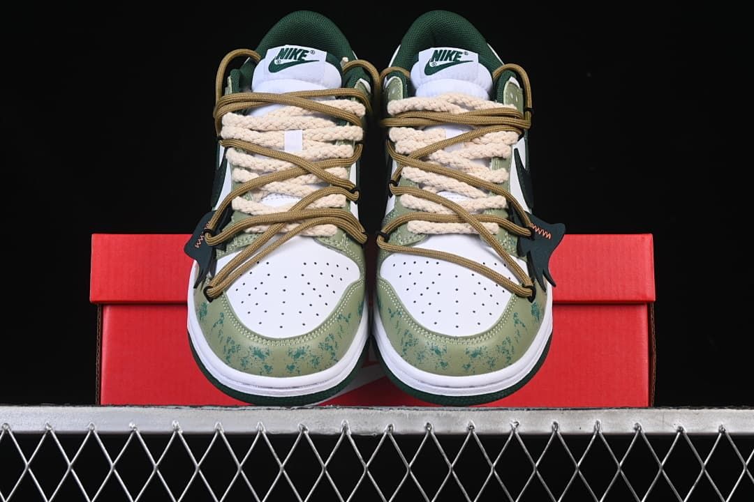 Front view of the pair showing perforated toes and layered laces