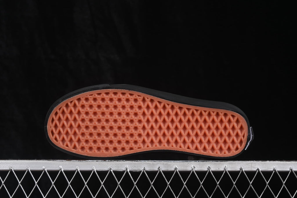 Underside view showing the gum-colored waffle-pattern outsole.