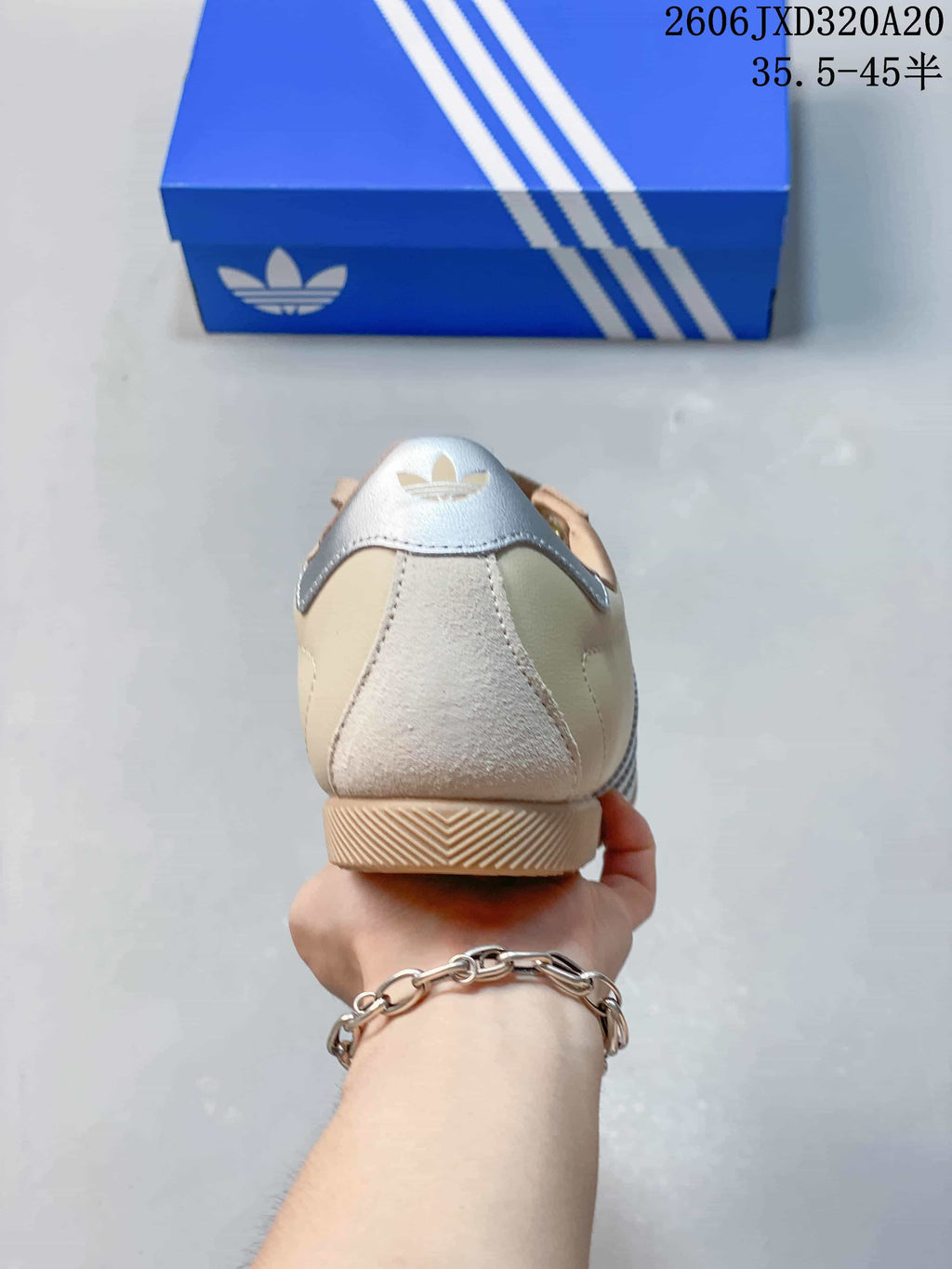 Rear view of the sneaker showing the suede-textured heel panel and silver heel detail
