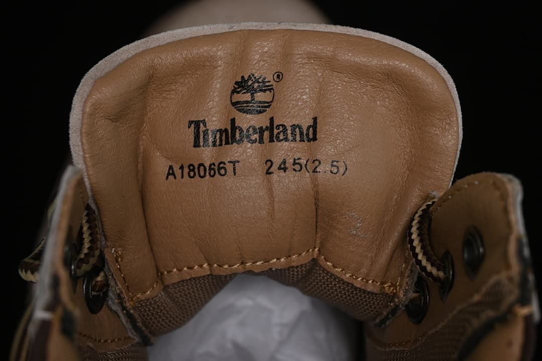 Tongue label showing Timberland, style A18066T, and photographed sample size 245 (2.5)