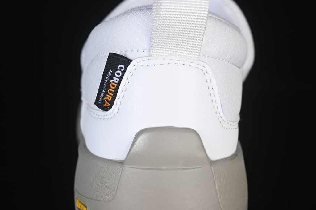 Rear view of the shoe showing its heel pull tab and grey outsole