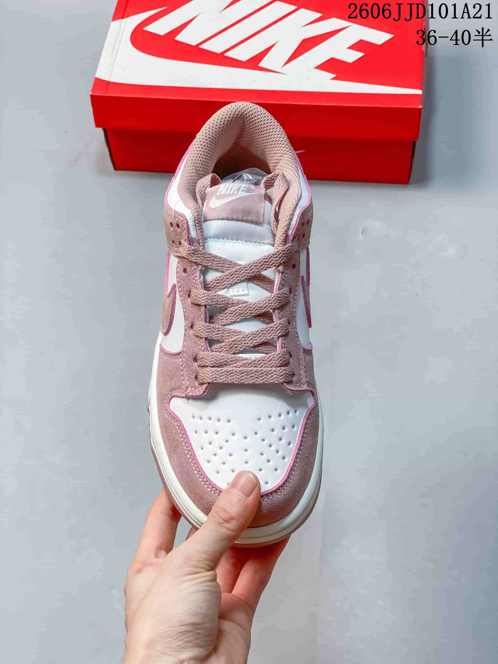 Front view of the sneaker showing its perforated toe box and lace-up design.