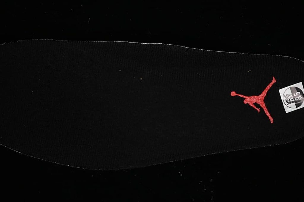 Black insole with a red Jumpman logo and a size marking.