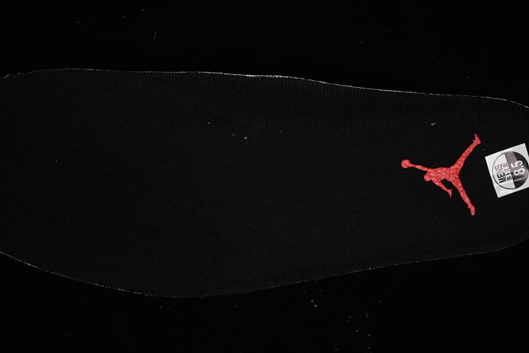 Black insole with a red Jumpman logo and a size marking.