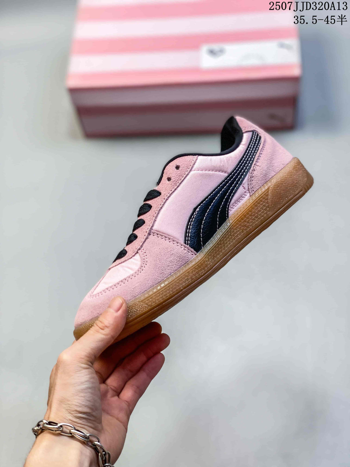 Side profile of a pink Puma Palermo sneaker showing the black side stripe and gum-colored sole