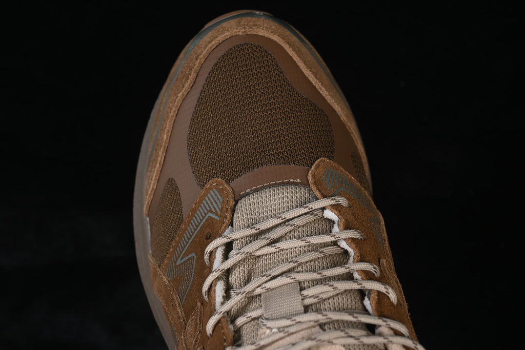 Top view of the brown mesh toe and lace area.