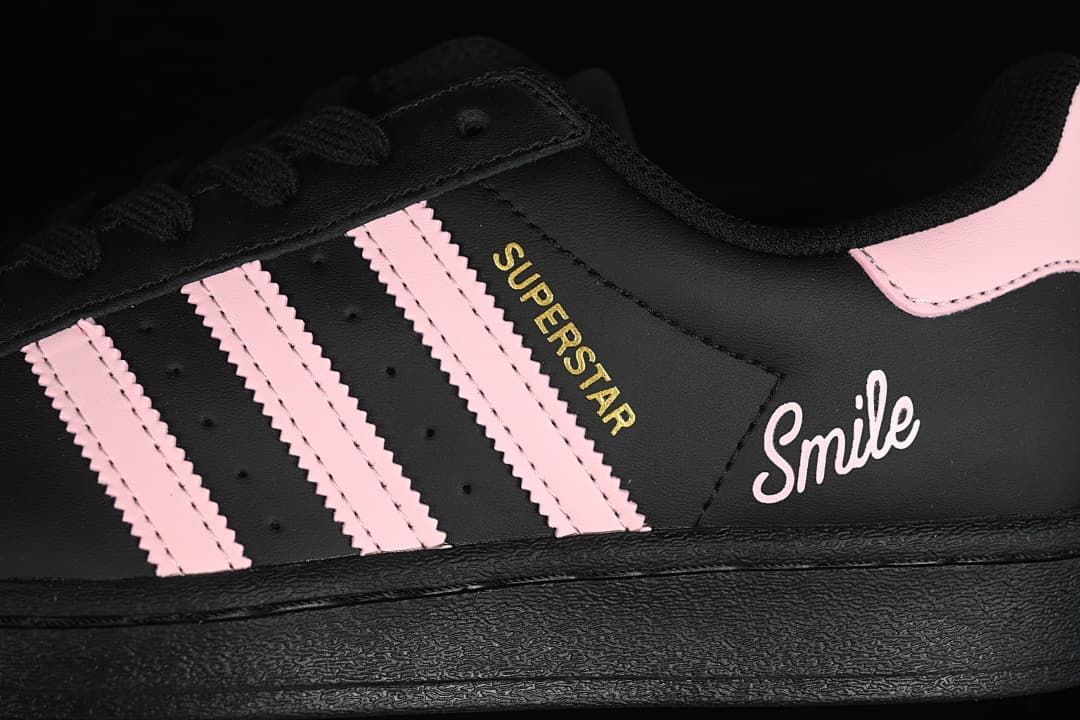 Close-up of pink stripes and Superstar and Smile side lettering