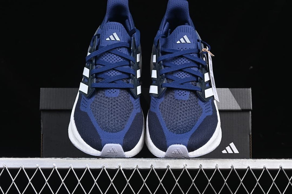 Front view of the pair showing blue uppers and white midsoles.