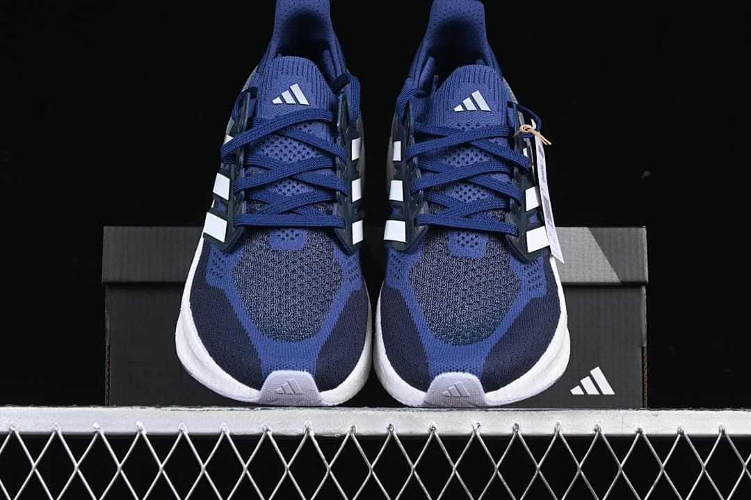 Front view of the pair showing blue uppers and white midsoles.