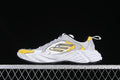 Side view of grey, white and yellow Balenciaga Monday low-top sneakers