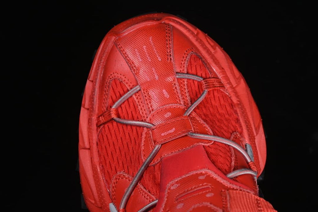 Top-down view of the red mesh-like upper and cord-style overlays