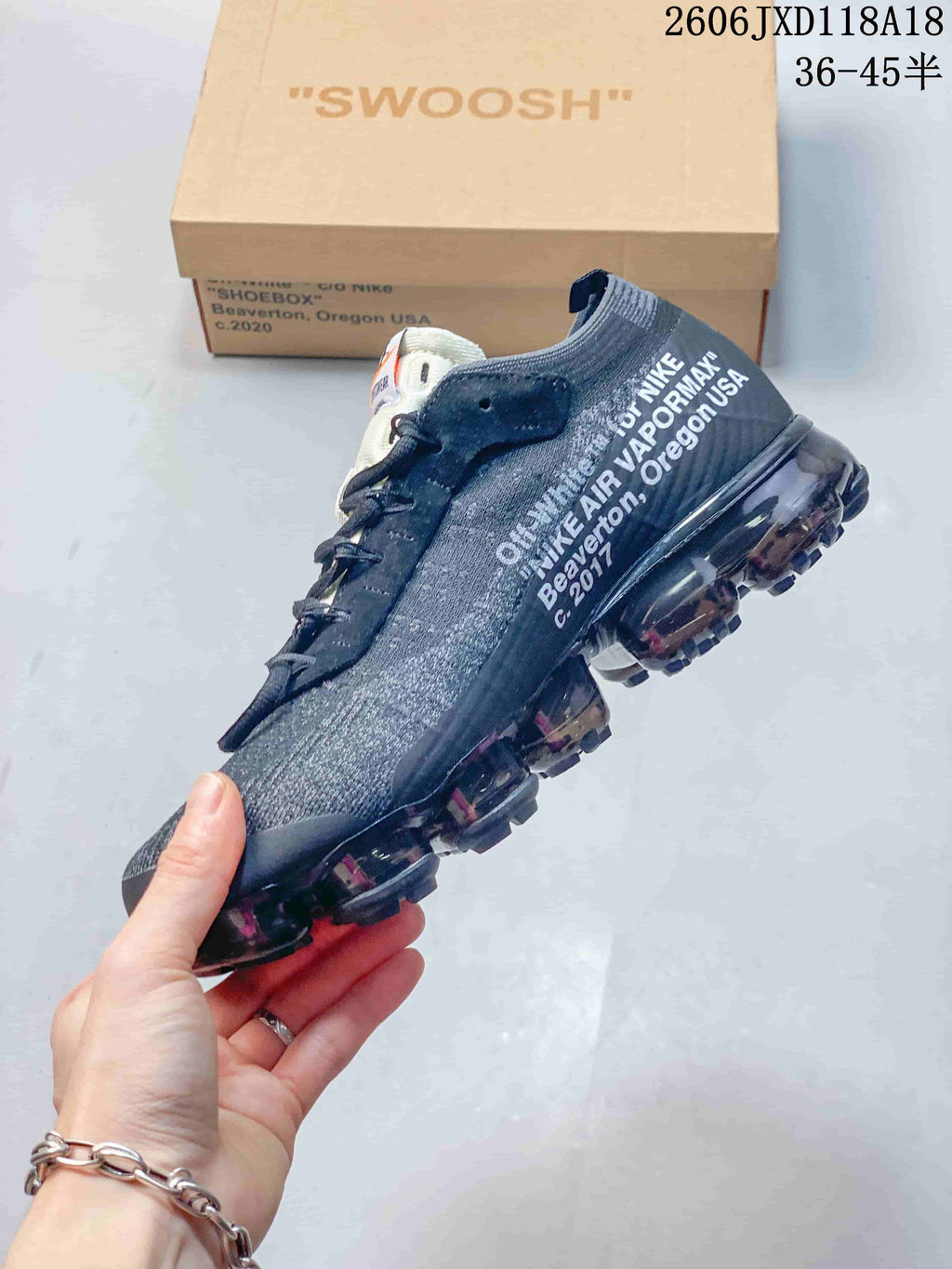 Side view showing gray knit-look upper, white lettering, and translucent segmented sole.