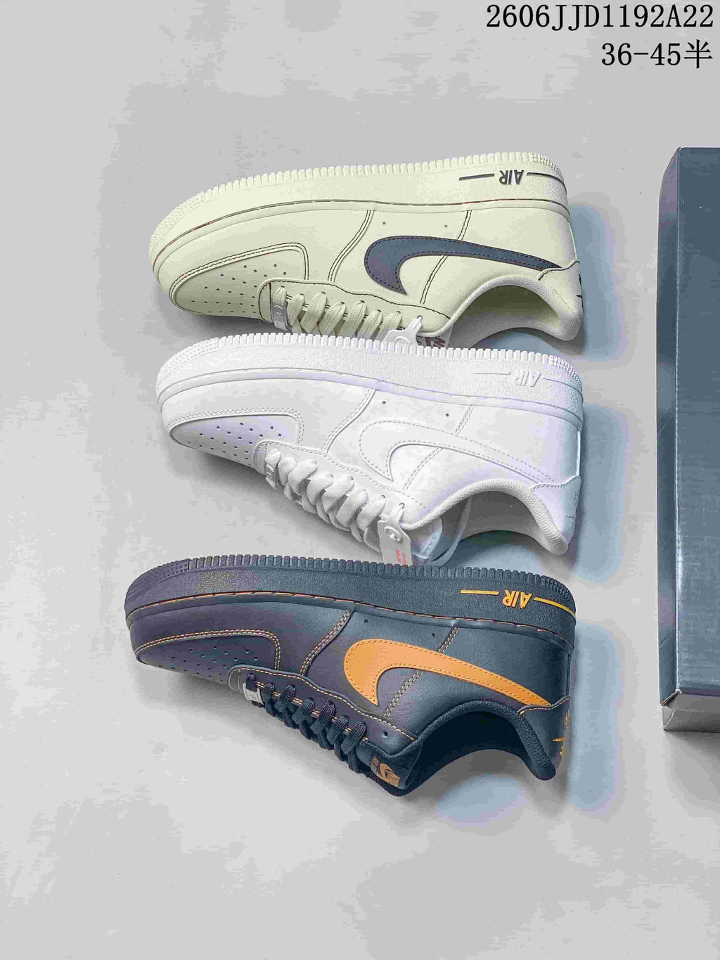 Three low-top sneakers shown from the side in white, cream, and charcoal colorways