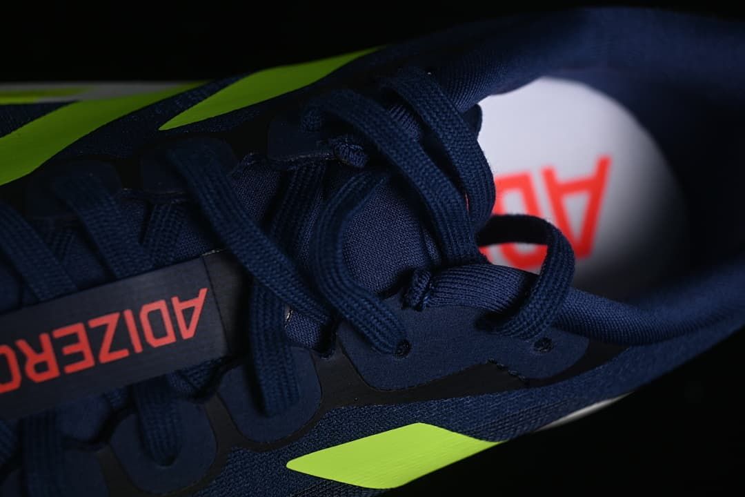 Top-down close-up of the navy laces and tongue.