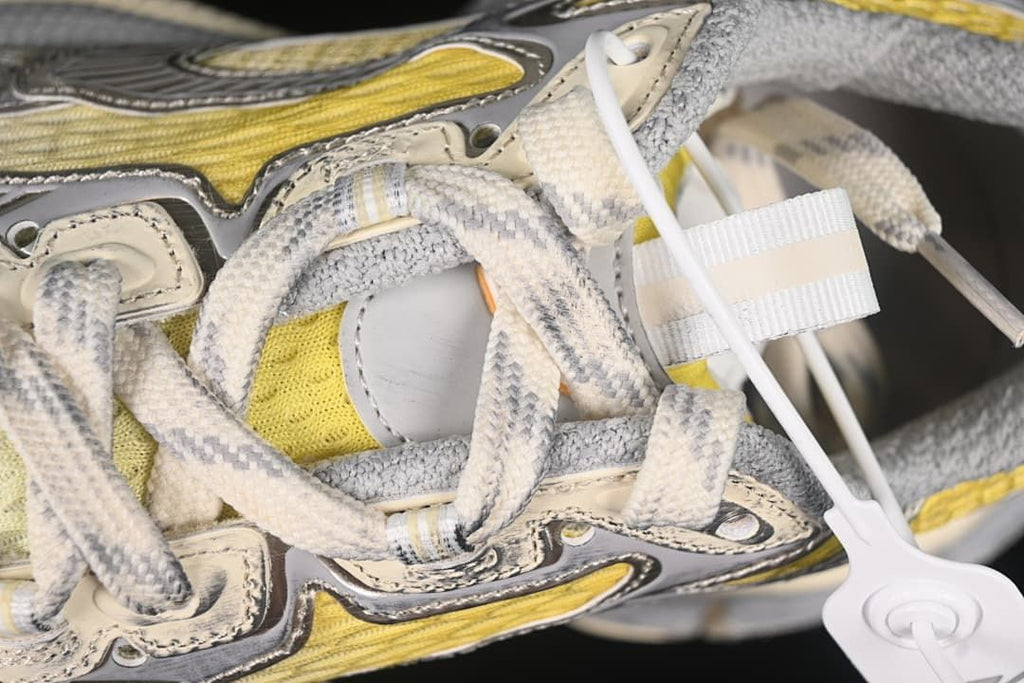 Detailed view of the laces and layered upper panels