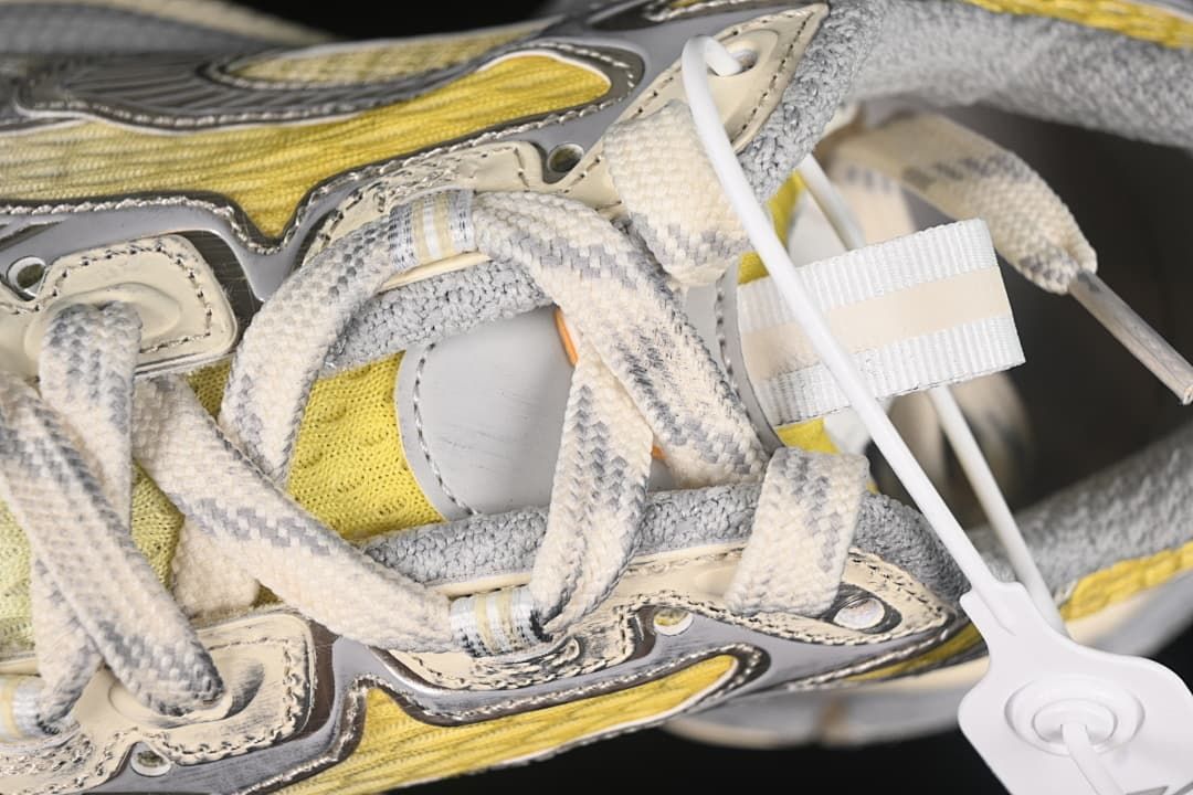 Detailed view of the laces and layered upper panels