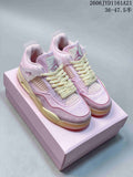 Pair of pink Jordan Air Jordan 4 Retro sneakers with cream laces, shown on a pink box.