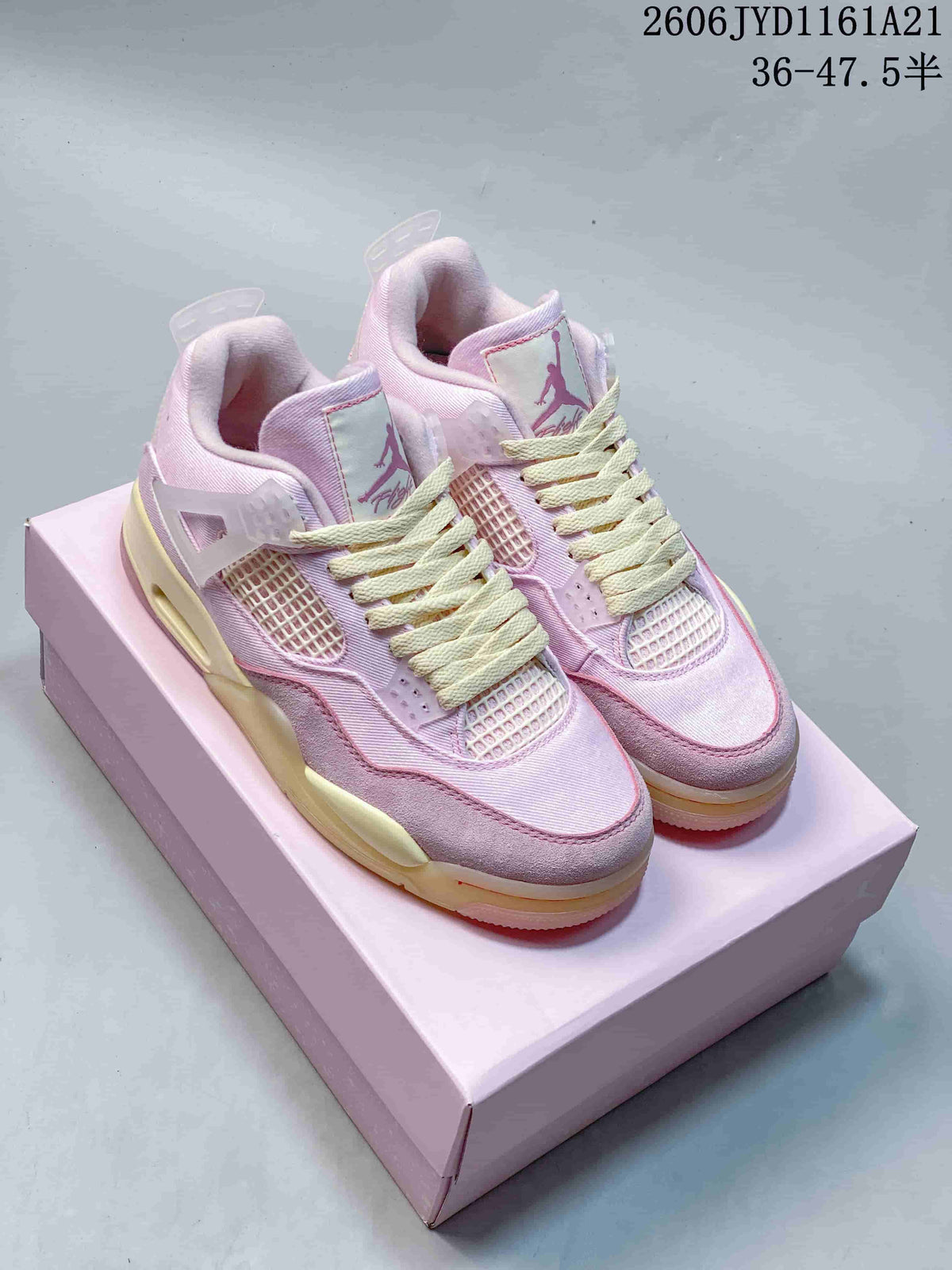 Pair of pink Jordan Air Jordan 4 Retro sneakers with cream laces, shown on a pink box.