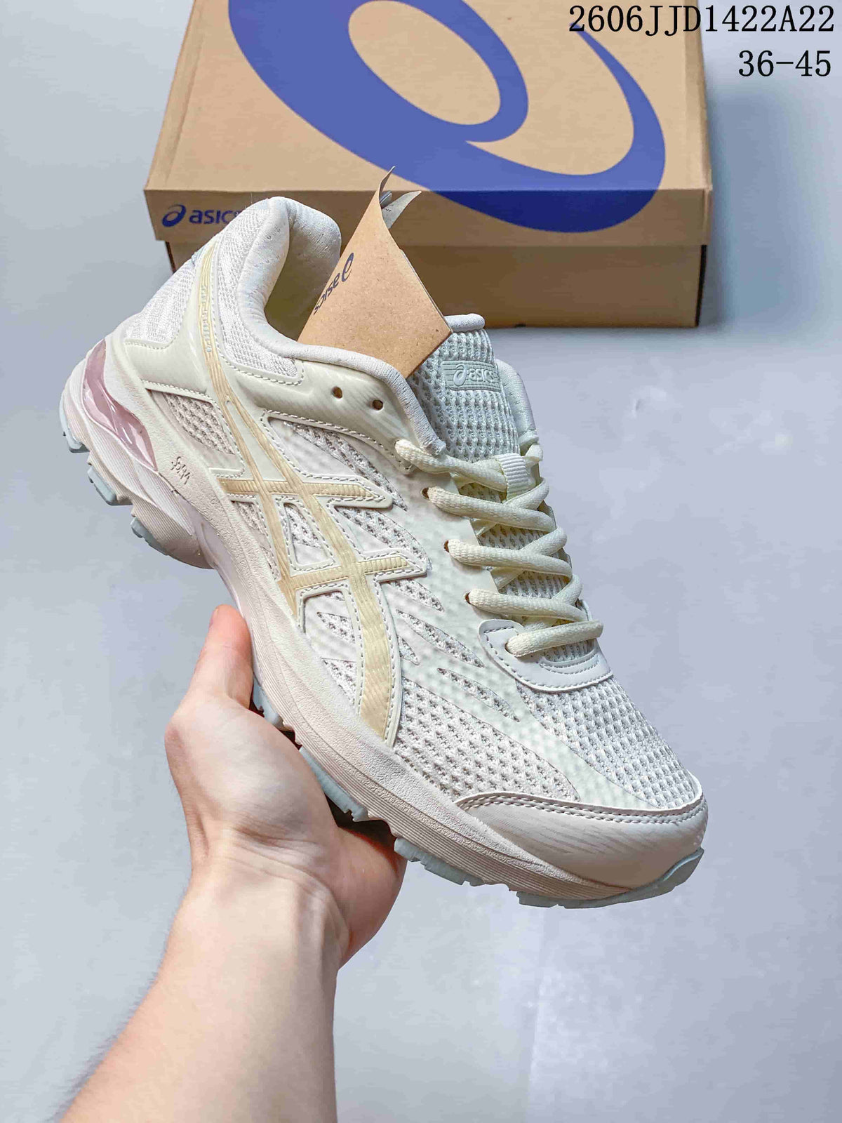 Cream-white ASICS GEL-FLUX shoe with pale gold-toned accents.