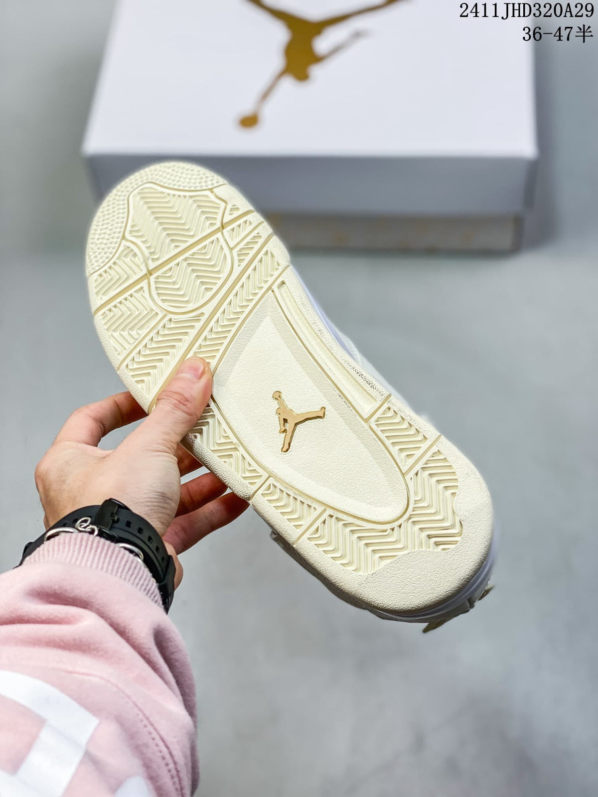 Close view of the ivory-toned patterned outsole and central Jumpman emblem.