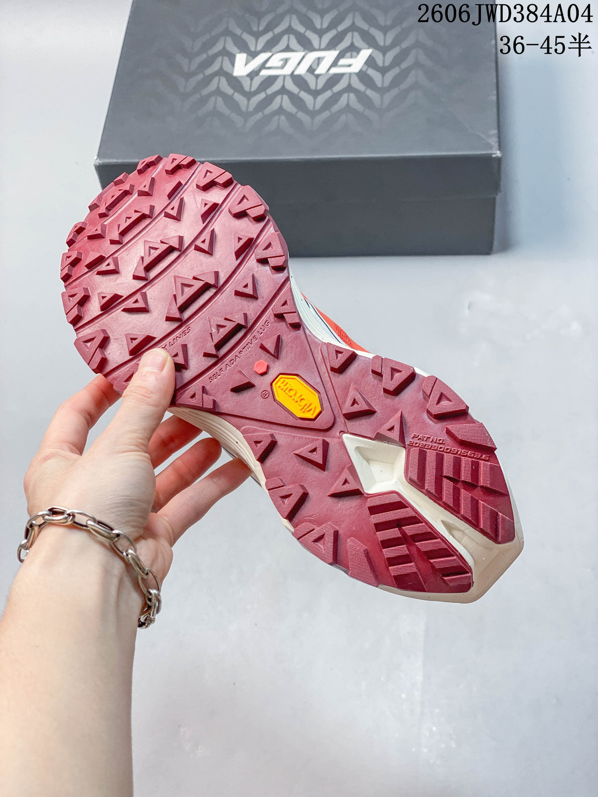 Close view of the lugged burgundy outsole, with a Vibram label visible.