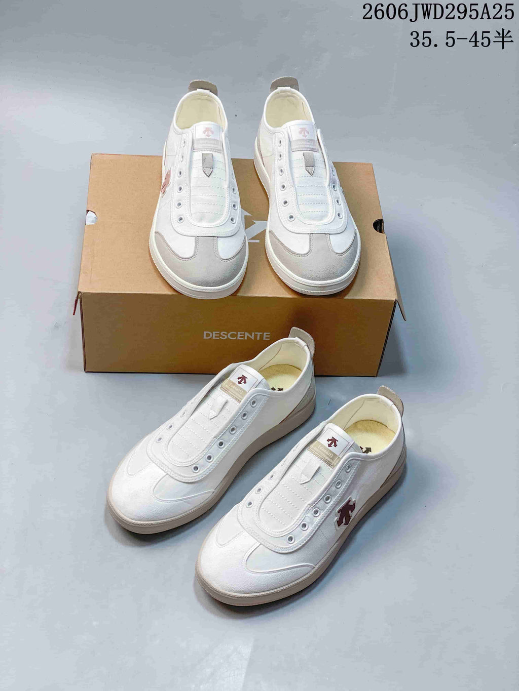 Several views of white and gray Descente CHRON low-top sneakers with their box.
