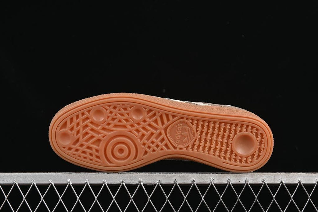 Underside view showing the patterned gum-colored outsole.