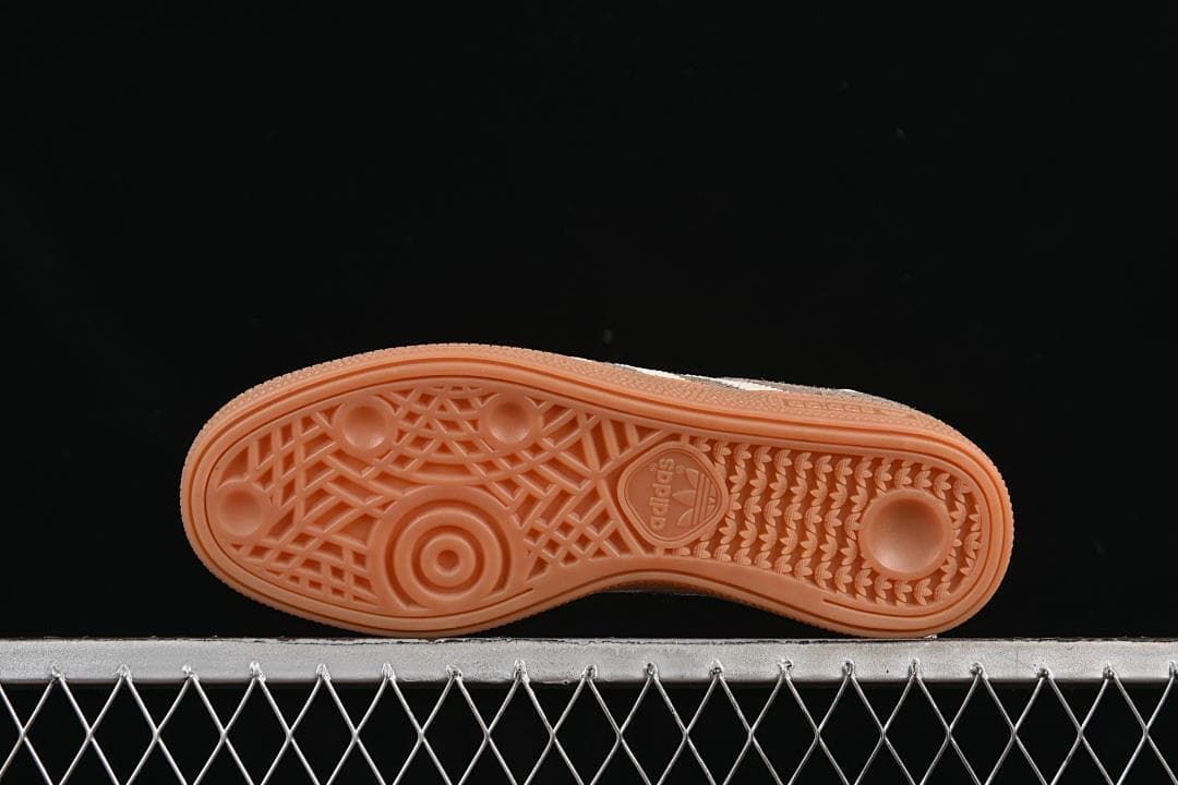 Underside view showing the patterned gum-colored outsole.