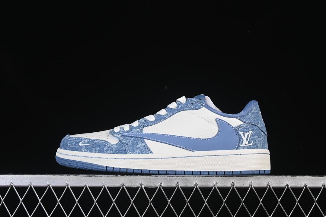 Side view of a blue denim-patterned and white Air Jordan 1 Low-style sneaker with a blue Swoosh.