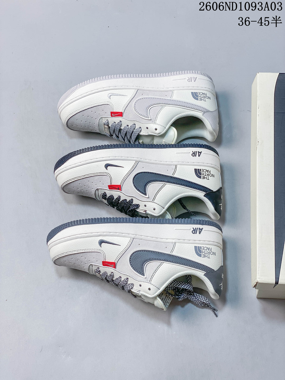 Three white and gray low-top sneakers arranged in side profile