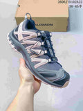 Gray and navy Salomon XA Pro 3D sneaker with pale pink side details and toggle lacing
